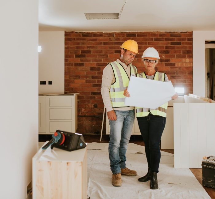 Contractor coworkers working together on remodeling home